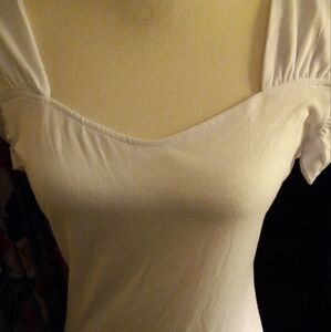 New,with tag workout white stretch knit short sleeve top wide straps size medium